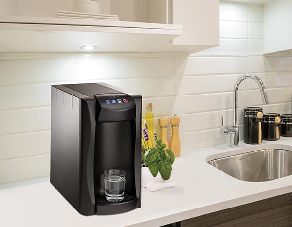 water dispenser for the home set up on the kitchen counter