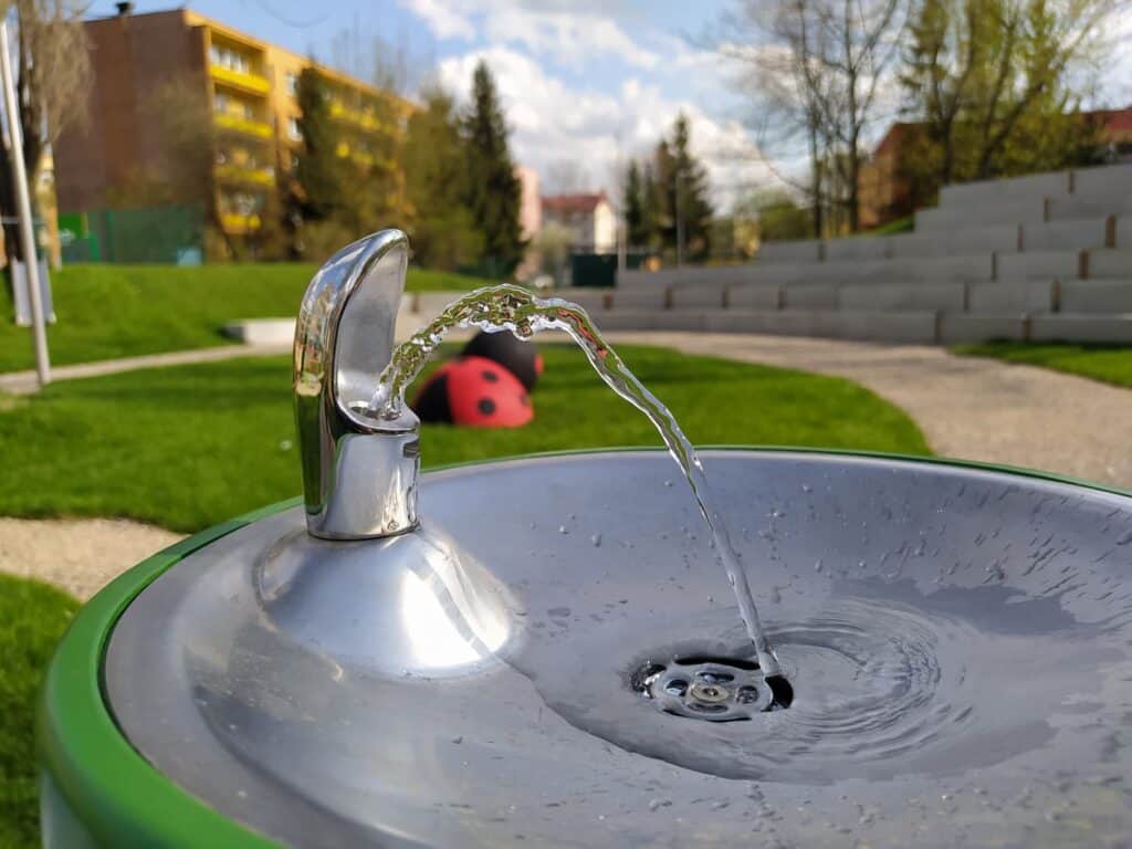 water pouring from a sanitised drinking water dispenser